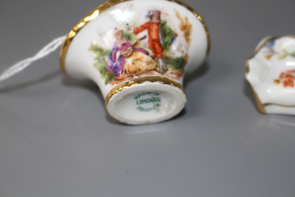 An eight piece Limoges porcelain miniature salon suite and a similar basket, 4.5cm